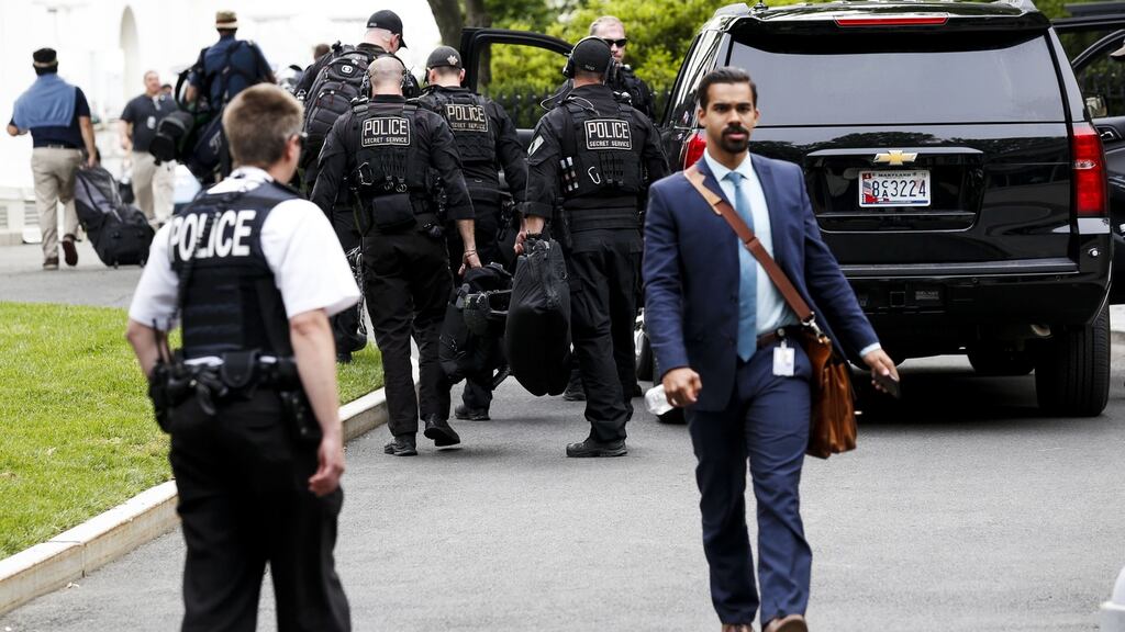 Members of the Secret Services return to the White House after an armed man was shot after brandishing a gun near the White House. Photograph: Aude Guerrucci - Pool/Getty Images