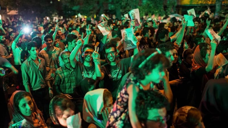 Rohani supporters celebrate his victory in Iran’s presidential election on a street in Tehran. Photograph: Fars News/Sina Shiri/Reuters