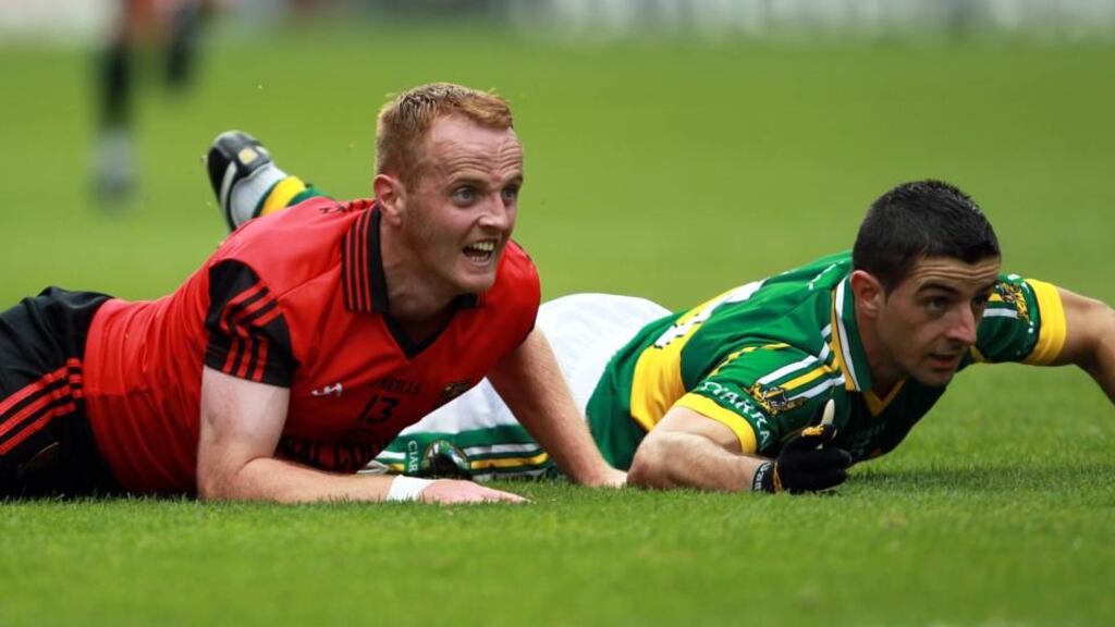 Benny Coulter and Aidan O’Mahony on the turf during Down’s memorable win over Kerry in 2010. Photograph: Donall Farmer/Inpho