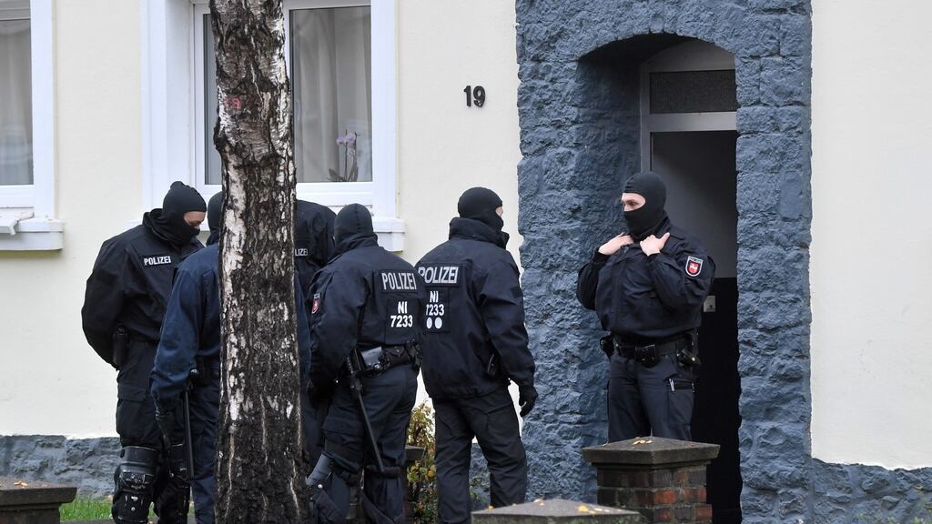 Police seach a building opposite the German-speaking Islamic Circle Hildesheim Mosque in Hildesheim, Germany on Tuesday. Photograph: EPA/Julian Stratenschulte