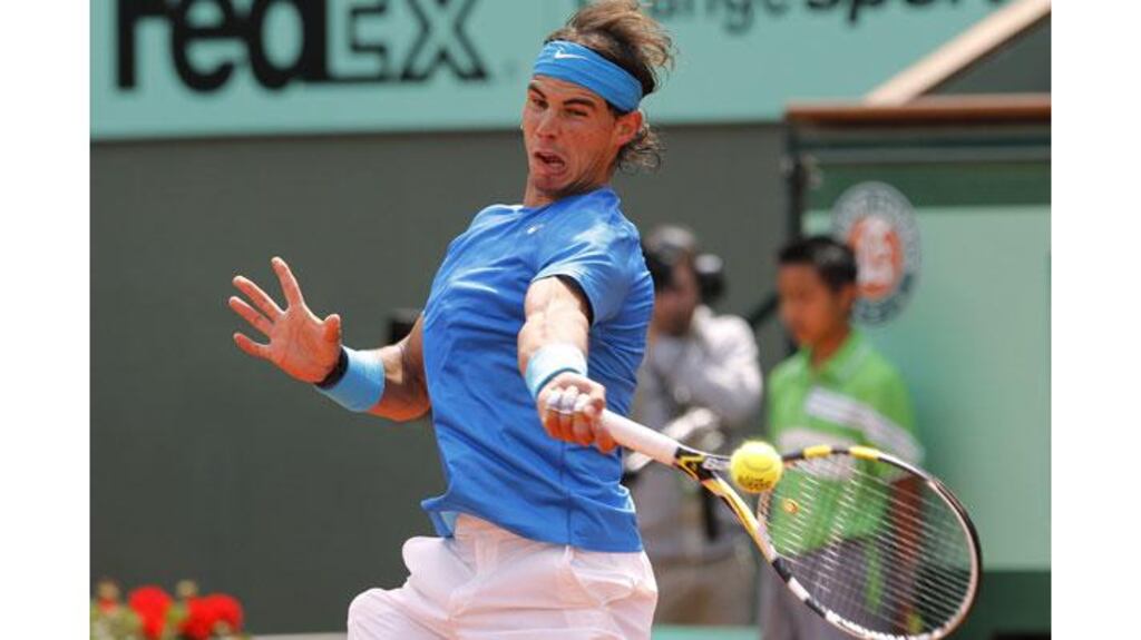 Spain's Rafael Nadal returns the ball to Croatia's Antonio Veic during his straight set win at the French Open. Photograph: Patrick Kovarik/AFP/Getty Images