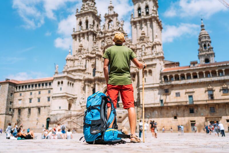 Standing on the main square in Santiago de Compostela at the end of the Camino de Santiago pilgrimage. Photograph: iStock