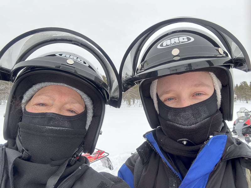 Natalie and August geared up for snowmobiling