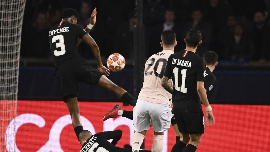 Paris Saint-Germain defender Presnel Kimpembe is struck on the arm by a shot from Manchester United’s Diogo Dalot’s during the game at the Parc des Princes. Photograph: Franck Fife/AFP/Getty Images
