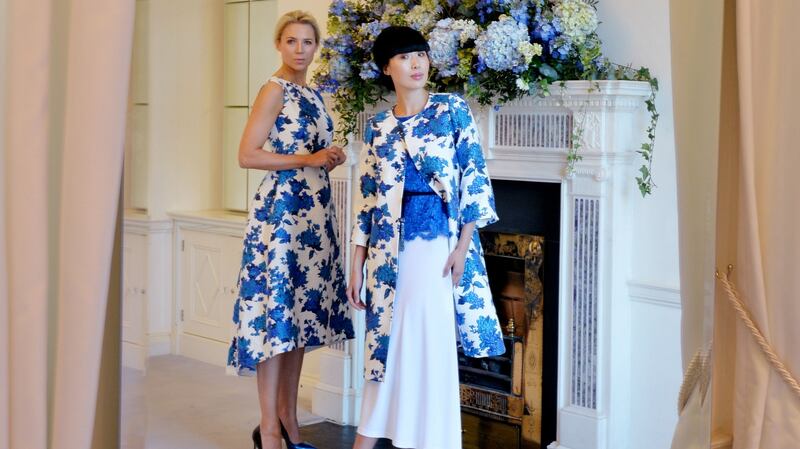 Sarah Mc Govern is wearing a Nina Dress in Sapphire and White Woven Jacquard and Yomiko Chen is wearing a coat in Sapphire & White Woven Jacquard, Nadia Sapphire lace blouseand Avery white Jersey skirt. Photograph: Alan Betson / The Irish Times