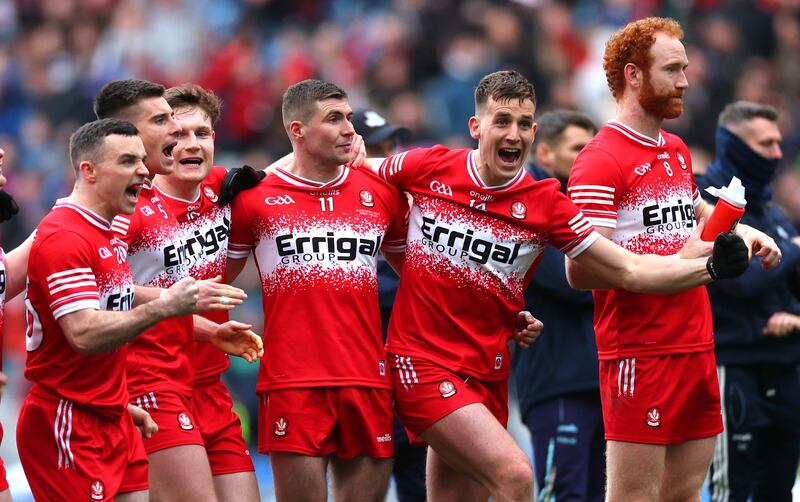 Derry’s Shane McGuigan, second right, leads the celebrations at the final whistle after victory over Dublin at Croke Park. Photograph: James Crombie/Inpho