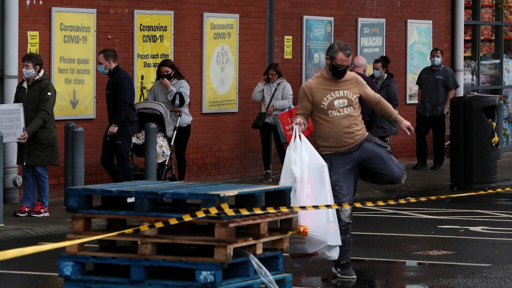 People queue outside Smyths Toys Superstore in Belfast as political frustration over Covid-19 restrictions continues. Photograph: Brian Lawless/PA Wire.
