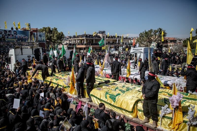 Coffins at a funeral for 95 people in Aitaroun, close to the Israeli border. Photograph: Sally Hayden