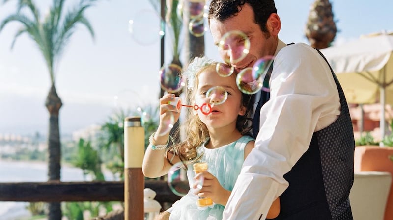 Capturing an "in between moment" at a wedding, photograph by John Dolan