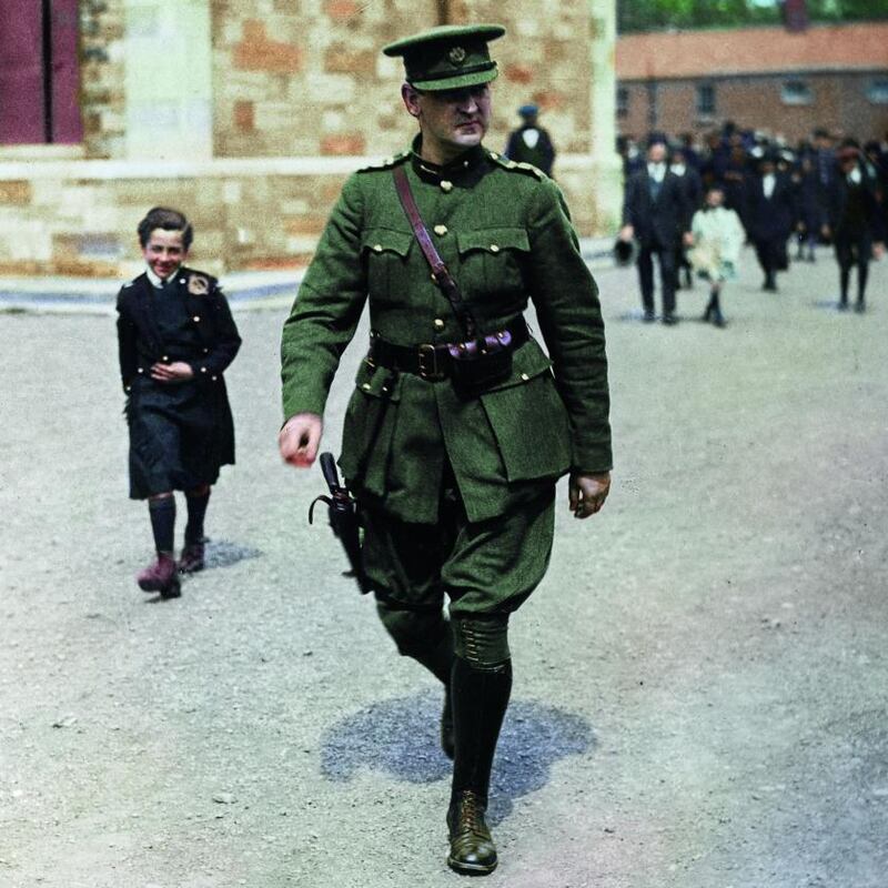 Colourised: Michael Collins leaves a Requiem service held at Portobello Barracks in Dublin. Original ohotograph: Popperfoto/Getty