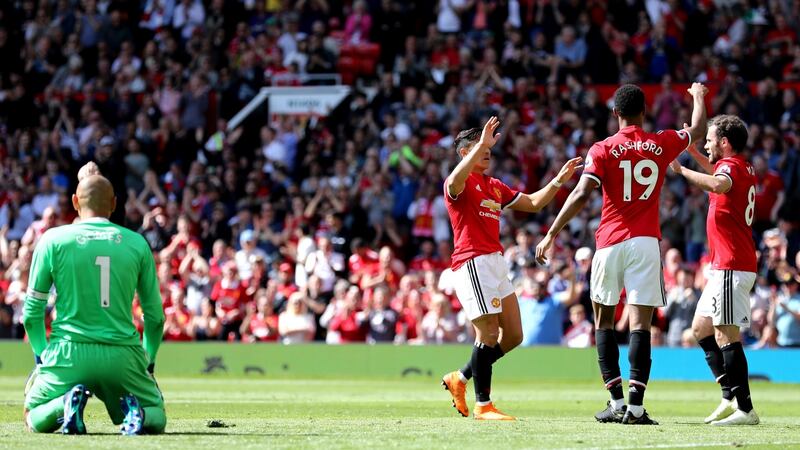 Marcus Rashford celebrates opening the scoring for Manchester United. Photograph: Matthew Lewis/Getty