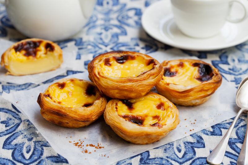 Enjoy a traditional pastel de nata, Portugal’s beloved custard tart