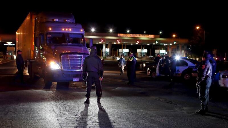 Policemen inspect a trailer at a checkpoint outside the Altiplano Federal Penitentiary, after drug lord Joaquin ‘El Chapo’ Guzman escaped, in Almoloya de Juarez, on the outskirts of Mexico City. Photograph: Tomas Bravo/Reuters