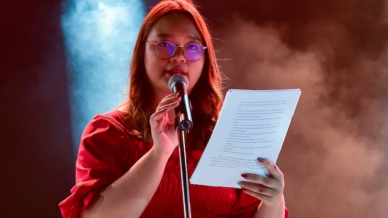 Student spokeswoman Panusaya Sithijirawattanakul reads a list of demands including the abolition of the kingdom’s draconian royal defamation law during a pro-democracy rally at Thammasat University. Photograph: Lillian Suwanrumpha/AFP via Getty