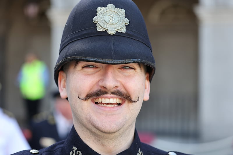 Garda Emmet Harte in an original uniform during a parade in Dublin marking 100 years since the first Garda commissioner led Ireland's new police service into Dublin Castle for the handover of policing duties from the British.