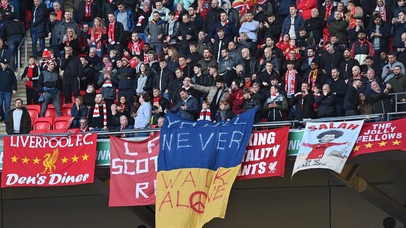 Liverpool fans display a Ukrainian flag during the League Cup final against Chelsea on Sunday. Photograph: Getty Images