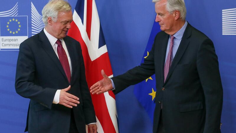 Negotiations begin: The UK’s David Davis is welcomed by Michel Barnier, the EU’s chief negotiator. Photograph: EPA/Stephanie Lecocq