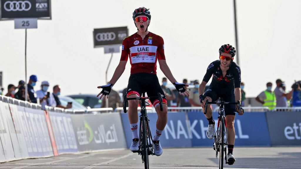 UAE Team Emirates’ Slovenian cyclist Tadej Pogacar celebrates upon crossing the finish line to win the third stage of the UAE Cycling Tour from Al Ain to Jebel Hafeet. Photograph: Giuseppe Cacace/AFP via Getty Images