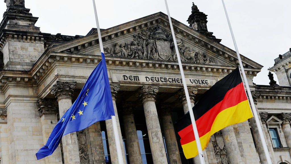 EU and German flags at half mast on the Reichstag parliament building in Berlin after the Nice attack. Photograph: Paul Zinken/EPA