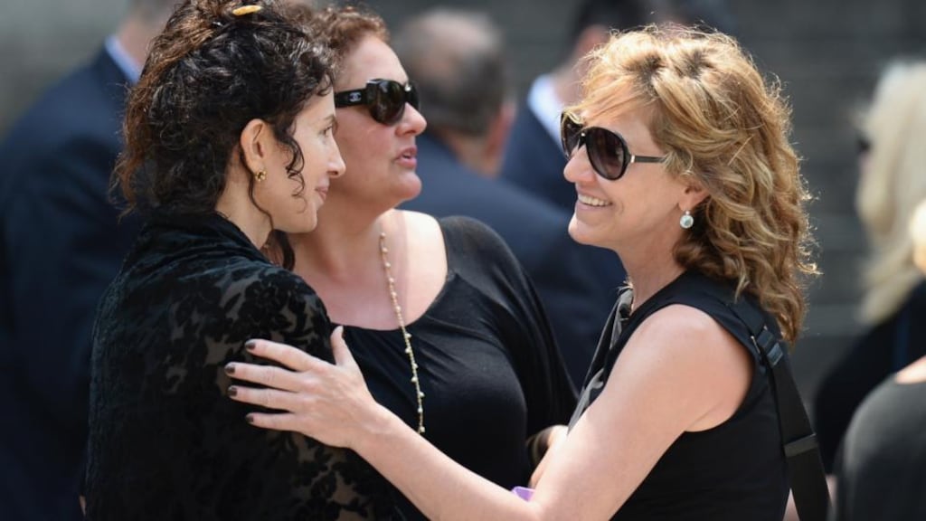 Sopranos cast members Aida Turturro (centre) and Edie Falco (right) attend the funeral of actor James Gandolfini at the Cathedral Church of St John the Divine in New York yesterday. Photograph: Mike Coppola/Getty Images