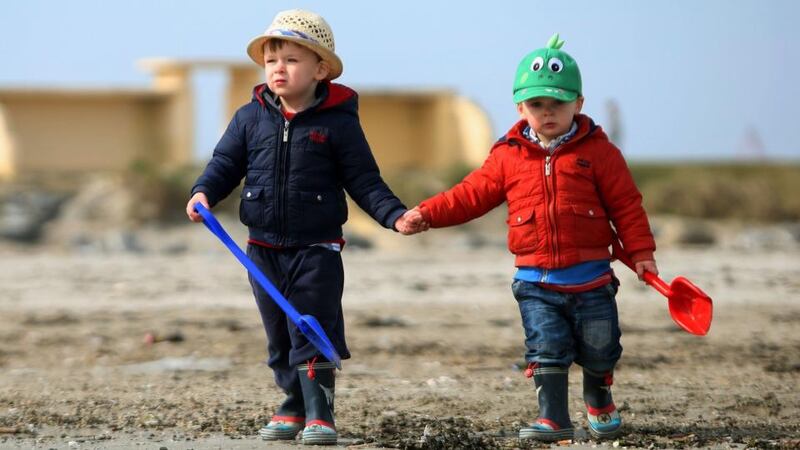 Brothers Michael (3) (left) and Patrick Wallace on Dollymount strand in Dublin during the warm April weather last week. Met Éireann said the warm spell is due to resume from midweek. Photograph: PA
