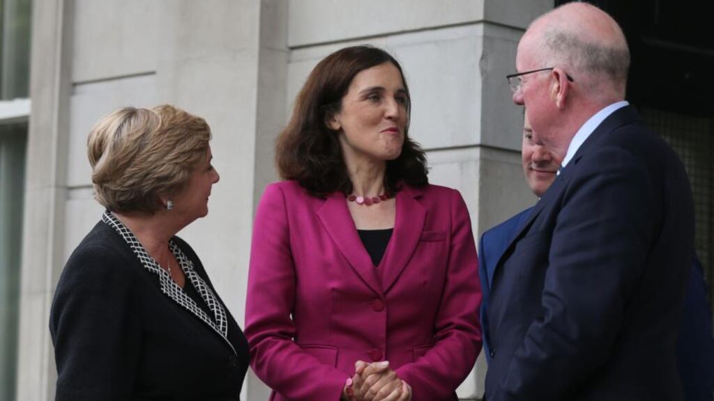 Northern Ireland Secretary Theresa Villiers (centre) leaving the Department of Foreign Affairs in Dublin after meeting Minister for Foreign Affairs Charlie Flanagan (right) and Minister for Justice Frances Fitzgerald last week. Photograph: Niall Carson/PA Wire.