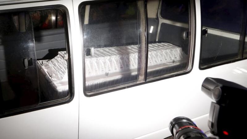 A coffin of a death row prisoner is pictured inside an ambulance as it arrives at Wijaya port. Photograph: Beawiharta/Reuters