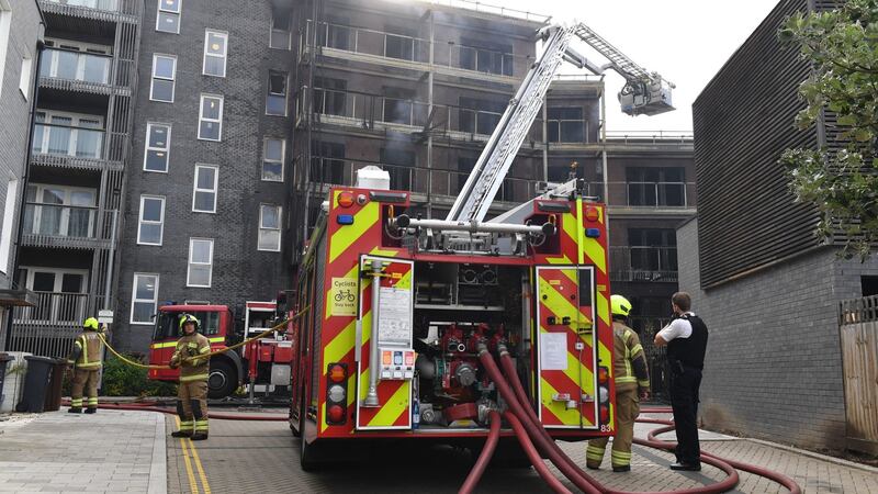 Firefighters deal with a blaze at a block of flats in Barking, east London, on Sunday. Photograph: Dominic Lipinski/PA Wire
