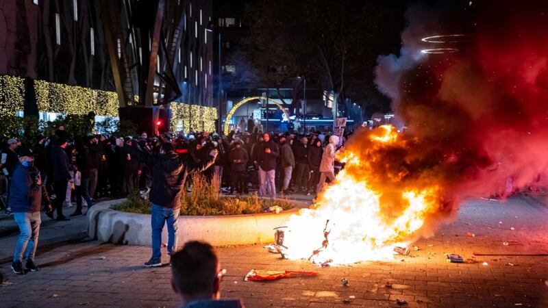 A scooter set on fire during a protest against Covid-19 measures in Coolsingel, Rotterdam, Netherlands on Friday. Photograph: Killian Lindenburg/EPA