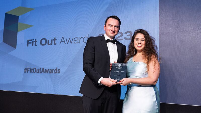 Dave Merriman, director at T&I Fitouts, presents fit out designer of the year – rising star award to Abigail Garcia, C+W O'Brien Architects