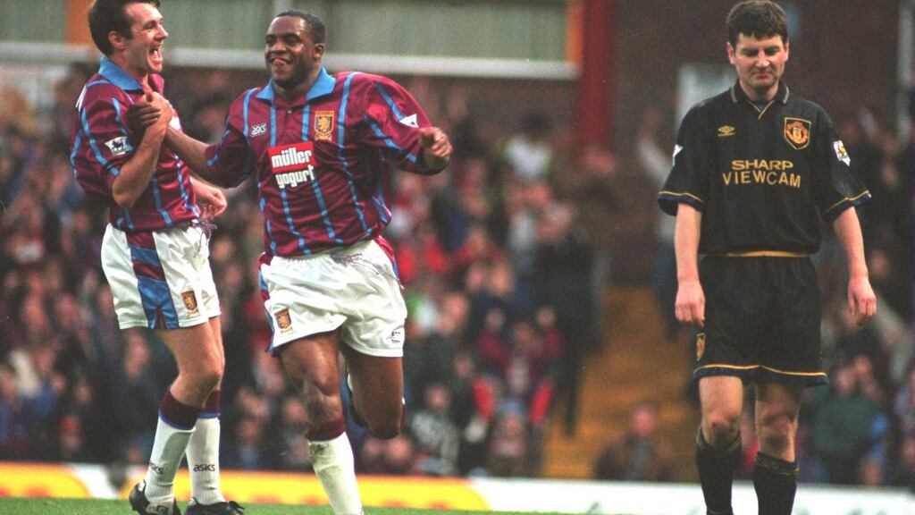 Dalian Atkinson celebrates with Ray Houghton after scoring against Manchester United in 1994. Photograph: David Rogers/Getty