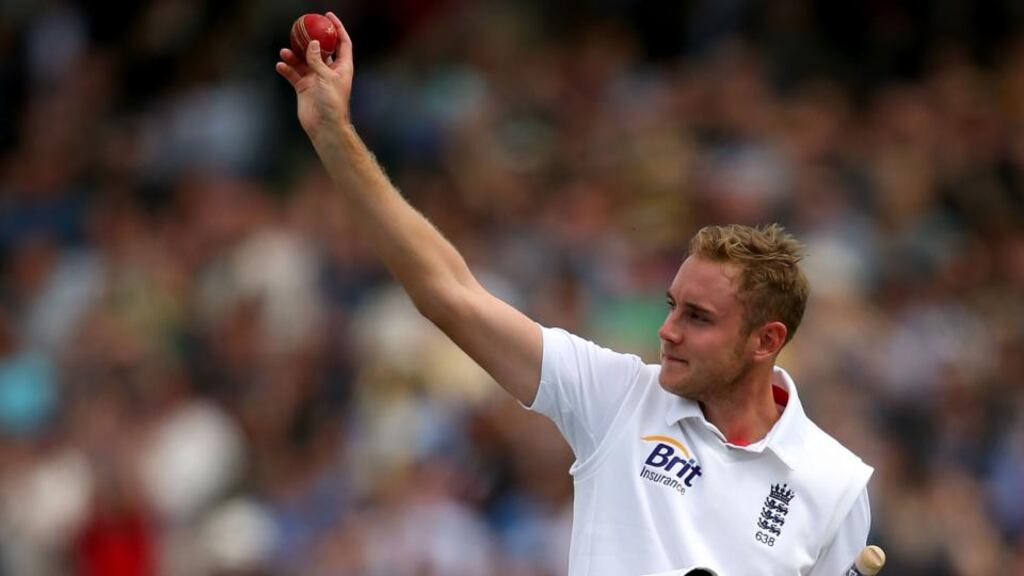 Stuart Broad of England raises the match ball to acknowledge the crowd as he leaves the field having guided England to victory against New Zealand. Photograph: Clive Rose/Getty Images