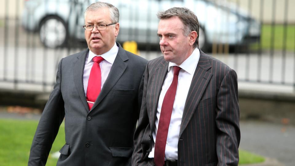 Fellow RTE Presenter Joe Duffy (left) and director general Noel Curran arrive for the funeral of Colm Murray at St Gabriels Church in Dollymount. Photograph: PA