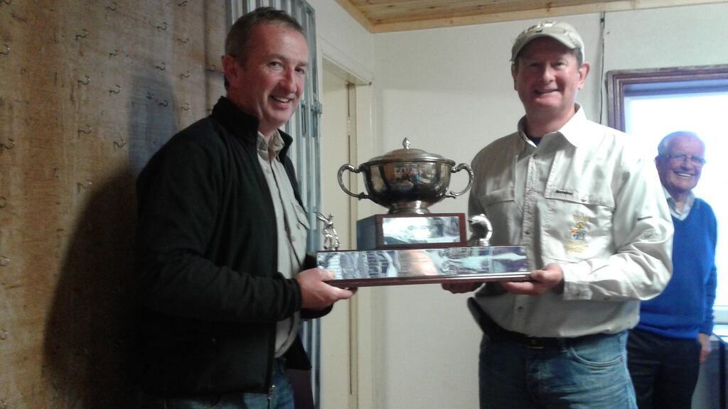 Michael Twohig, Kanturk (right) receiving the Ballinrobe anglers’ trophy from chairman Kevin Egan.