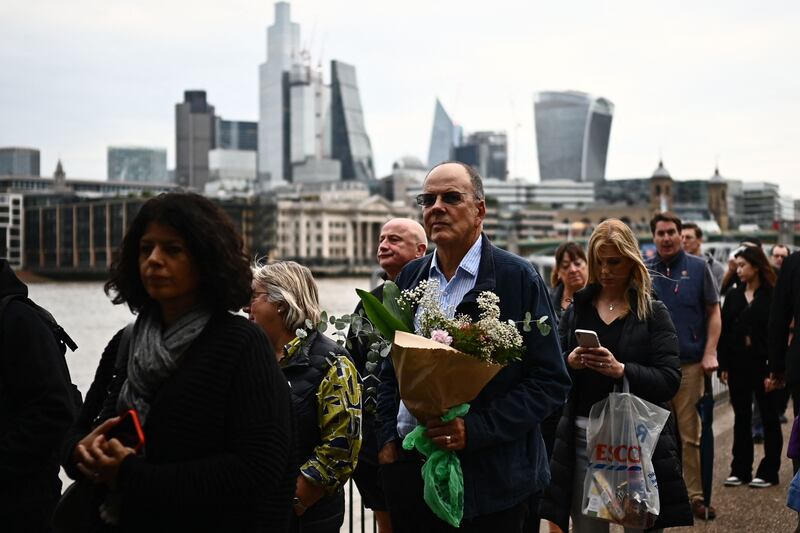 People wait in line to pay their respects to Queen Elizabeth II in London. Photograph: MARCO BERTORELLO/AFP via Getty Images