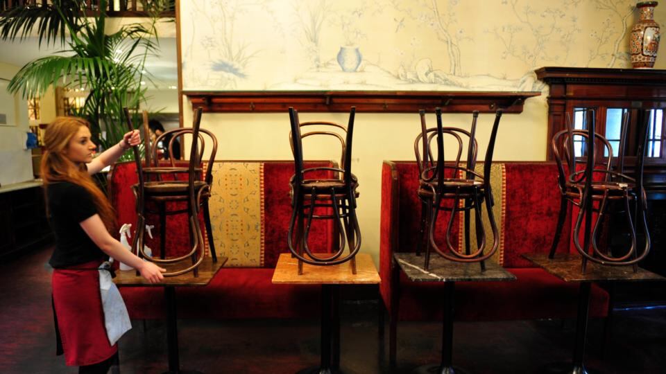A staff members stacks chairs at Bewley’s on Grafton Street ahead if its closure for a six-month refurbishment. Photograph: Aidan Crawley/The Irish Times
