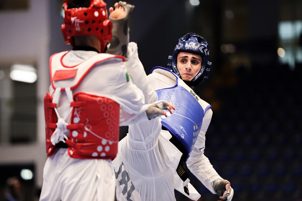 Ireland’s Jack Woolley in action against Matias Lomartire of Italy. Photograph: Tom Maher/Inpho