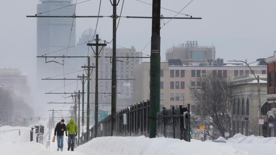 Pedestrians walk along snow covered, MBTA subway rails on Commonwealth Avenue in Boston, Massachusetts. Photograph: Reuters