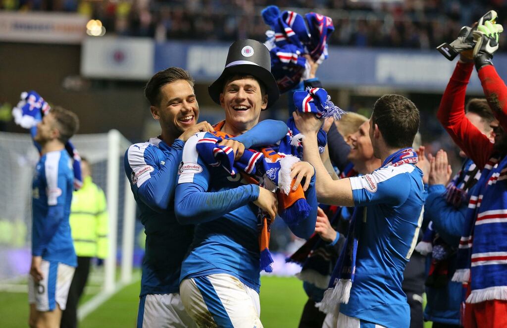 Rangers’ Rob Kiernan and Harry Forrester celebrate after the Ladbrokes Scottish Championship match at Ibrox Stadium. Photograph: Andrew Milligan/PA
