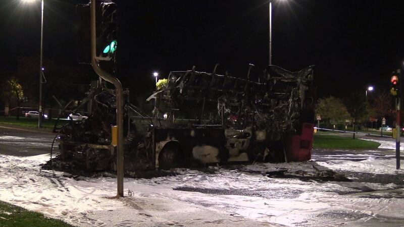 A burnt-out double decker bus on Church Road, near Rathcoole, Newtownabbey, Co Antrim, after it was hijacked and set on fire near a loyalist estate on the outskirts of Belfast on Sunday night. Photograph: David Young/PA Wire