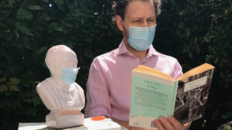 UCC philosopher Vittorio Bufacchi and Cicero both masked up during the lockdown.