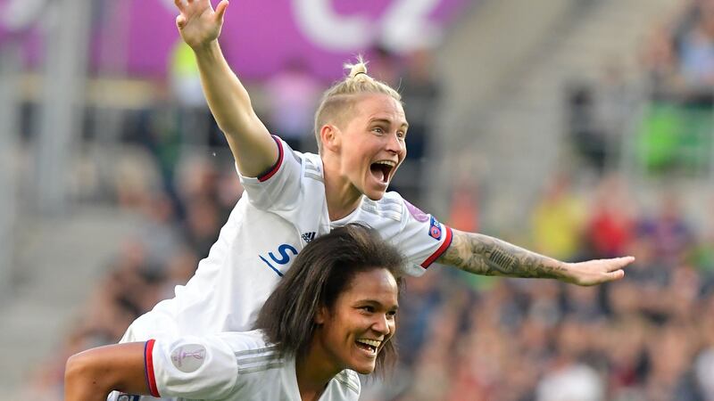 Lyon’s Welsh midfielder Jess Fishlock celebrates with French defender Wendie Renard after their victory over Barcelona in the Women’s Champions League final in Budapest. Photograph: Tobias Schwarz/AFP/Getty Images