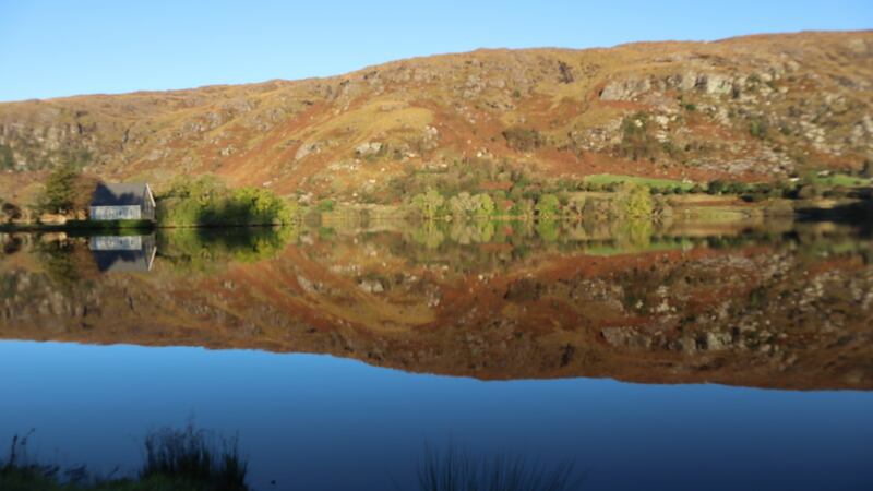 The low winter sun turned the steep slopes on the northern side to gold, which was perfectly mirrored in the still waters