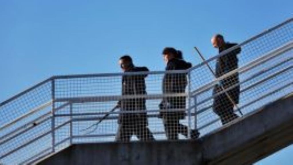 Gardaí at a pedestrian bridge at Priorsgate, in Tallaght, where Dale Creighton was assaulted in New Year’s Day. Photograph: Colin Keegan/Collins