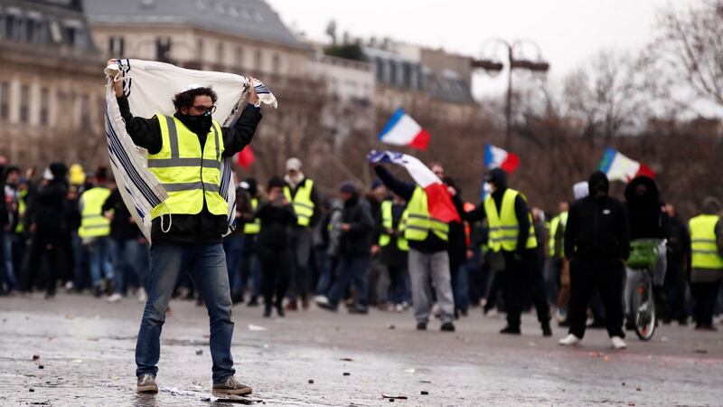 Protesters mobilise near the Arc de Triomphe. Photograph: Reuters