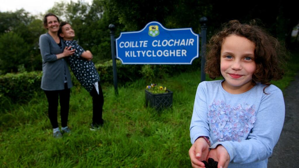 Tammy Barrett and her children Aidan and Jessica in Kiltyclogher, Co Leitrim. “I love it to bits. This is like a fairy tale in my head.” Photograph:  Brian Farrell
