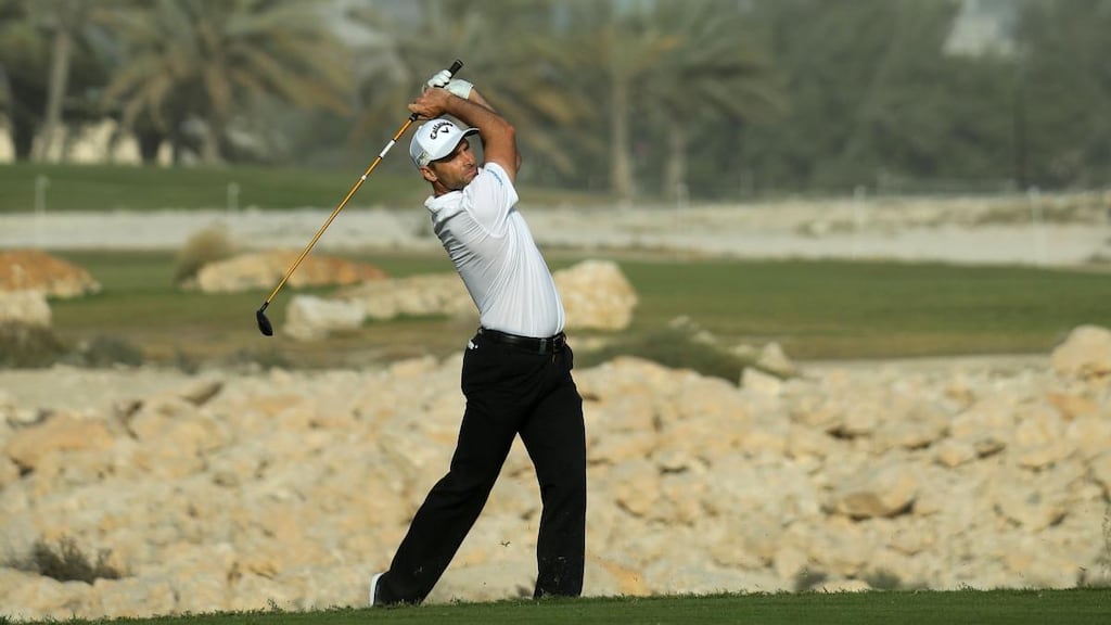 Oliver Wilson of England plays into the 18th green during the third round of the Commercial Bank Qatar Masters. Photograph: Warren Little/Getty Images