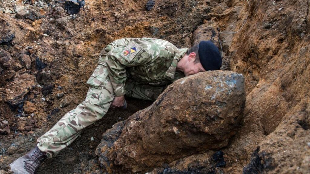 A Royal Logistic Core bomb disposal expert checking the fuse on the second World War 1,000lb ordnance bomb which was found by construction workers in Bermondsey, south-east London. Photograph: Sergeant Rupert Frere/PA