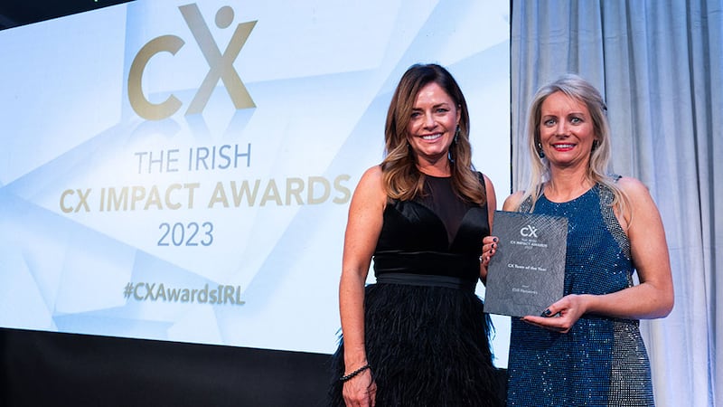 Rachael Corcoran, awards judge, presents the CX team of the year award to Dervla O'Flaherty, ESB Networks.