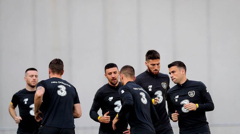 Ireland warm up ahead of their stalemate with Georgia. Photograph: Ryan Byrne/Inpho